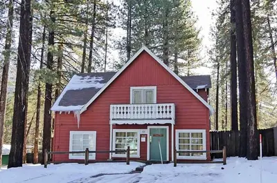 a red barn in the woods in the snow at 3664 Birch Avenue cabin in South Lake Tahoe