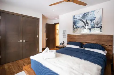 a bedroom with two beds and a ceiling fan at West Shore - West Shore Hideaway in Tahoma
