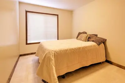 a bedroom with a bed and a window at Cozy Lake-View Hideaway! Pet-Friendly Truckee Home in Truckee