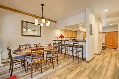 a dining room and kitchen with a table and chairs at Forest-View Gem 2 Mi to Diamond Peak Ski Resort! in Incline Village