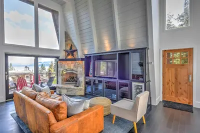 a living room with leather furniture and a fireplace at 10 Mi to Skiing Tahoe City A-Frame Home in Tahoe City