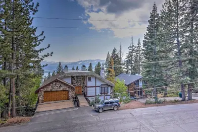 a house with a car parked in front of it at 10 Mi to Skiing Tahoe City A-Frame Home in Tahoe City