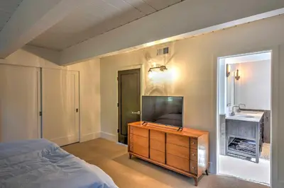 a bedroom with a bed and a dresser with a television at 10 Mi to Skiing Tahoe City A-Frame Home in Tahoe City