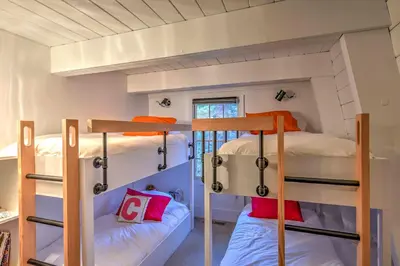 a bunk bed room with two bunk beds in it at 10 Mi to Skiing Tahoe City A-Frame Home in Tahoe City