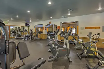 a gym with several treadmills and exercise bikes at Family-Friendly Truckee Cabin Near Ski Shuttle! in Truckee
