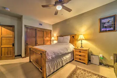 a bedroom with a bed and a ceiling fan at Central Mammoth Lakes Townhome about 1 Mi to Slopes in Mammoth Lakes