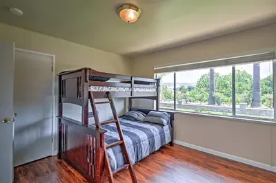 a bedroom with a bunk bed and a window at 7 Mi to Dtwn Gilroy Spacious Home on 20 Acres! in Gilroy