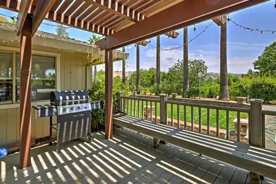 a patio with a bench and a grill at 7 Mi to Dtwn Gilroy Spacious Home on 20 Acres! in Gilroy