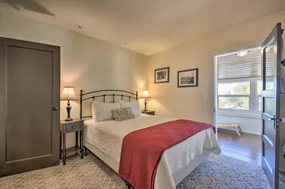 a bedroom with a bed and a window at Historic Mariposa Stagecoach Stop with Gas Fire Pit! in Mariposa
