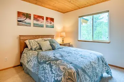 a bedroom with a bed and a window at Hot Tub Access, Near Skiing Tahoe Donner Cabin in Truckee