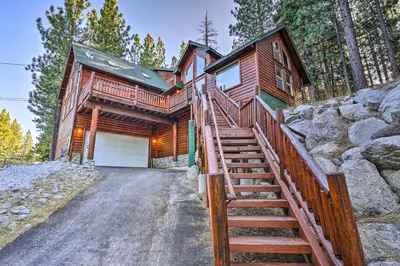 a log home with stairs leading to a garage at Hot Tub, Indoor Pool! Home 8 Mi to Heavenly Skiing in South Lake Tahoe
