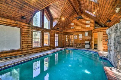 a swimming pool in a wooden house with a ceiling at Hot Tub, Indoor Pool! Home 8 Mi to Heavenly Skiing in South Lake Tahoe
