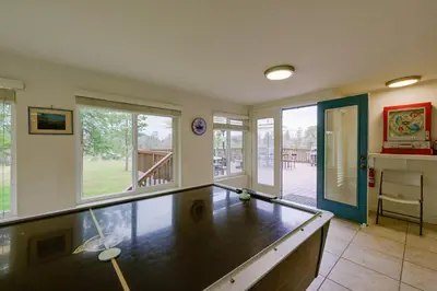 a living room with a ping pong table in it at 7 Mi to Bass Lake! Spacious Mudge Ranch Retreat in Coarsegold