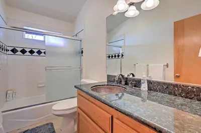 a bathroom with a sink and a toilet and a mirror at Family Tahoe Donner Retreat Less Than 2 Mi to Downhill Ski in Truckee