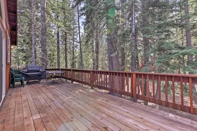a wooden deck with a table and a bench on it at Family Tahoe Donner Retreat Less Than 2 Mi to Downhill Ski in Truckee