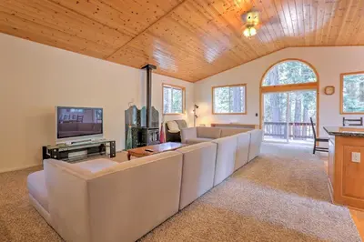 a living room with couches and a flat screen tv at Family Tahoe Donner Retreat Less Than 2 Mi to Downhill Ski in Truckee