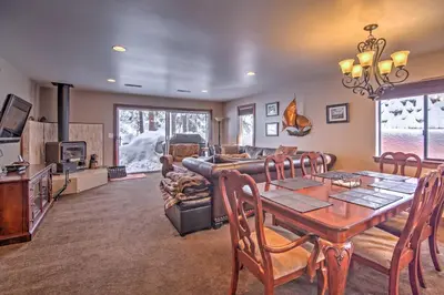 a living room with a table and a couch at Private Deck and Community Pool Incline Village Gem in Incline Village