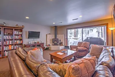 a living room with a leather couch and a table at Private Deck and Community Pool Incline Village Gem in Incline Village