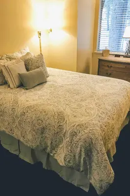 a bedroom with a large bed with pillows on it at Private Deck and Community Pool Incline Village Gem in Incline Village
