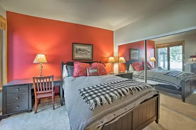 a bedroom with a bed and a desk and a chair at Mammoth Lakes Vacation Rental with Community Hot Tub in Mammoth Lakes