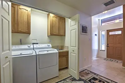 a kitchen with a washer and dryer in a room at Rustic Truckee Lodge with Rec Room - Near Northstar! in Truckee