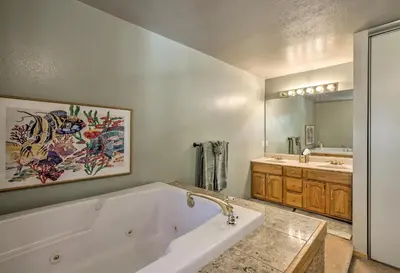 a large bathroom with a tub and a sink at Cabin Less Than 2 Mi to Tahoe Donner Downhill Ski Resort in Truckee
