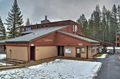 a large building with a garage in the snow at Cabin Less Than 2 Mi to Tahoe Donner Downhill Ski Resort in Truckee