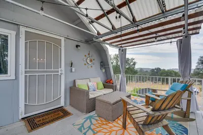 a screened in porch with a couch and chairs at Mariposa Home Furnished Patio and Sierra Mtn Views in Mariposa