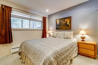 a bedroom with a bed and a window at 1 Mi to Diamond Peak Ski Resort Condo with Pool in Incline Village
