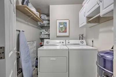a white washer and dryer in a small kitchen at 1 Mi to Diamond Peak Ski Resort Condo with Pool in Incline Village