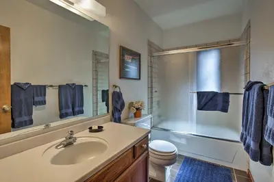 a bathroom with a sink and a shower and a toilet at 11 Mi to Palisades Tahoe Lakefront Home with View! in Tahoe City