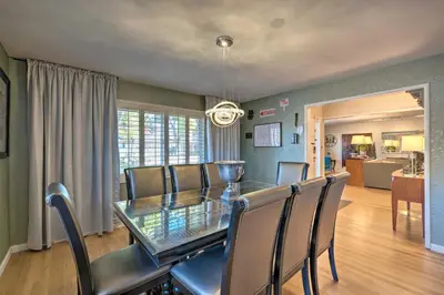 a dining room with a glass table and chairs at Spacious Wine Country Home 1 Mi to Downtown Lodi! in Lodi