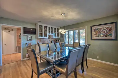 a dining room with a glass table and chairs at Spacious Wine Country Home 1 Mi to Downtown Lodi! in Lodi