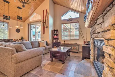 a living room with a couch and a fireplace at Mammoth Lakes Townhome - 10-Min Walk to Village! in Mammoth Lakes