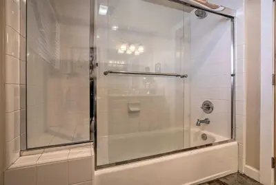 a shower with a glass door in a bathroom at Mammoth Lakes Townhome - 10-Min Walk to Village! in Mammoth Lakes