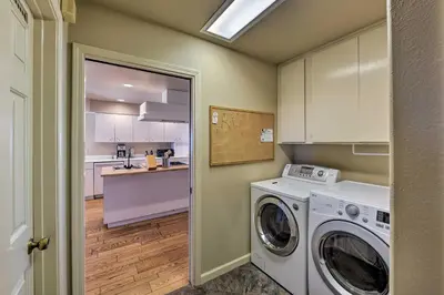 a kitchen with a washer and dryer in a room at Working Vineyard and Private Pool Villa in Plymouth in Plymouth