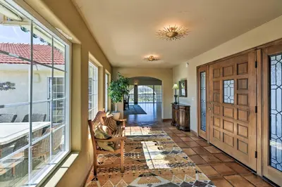 a home with a hallway with a large window at Working Vineyard and Private Pool Villa in Plymouth in Plymouth