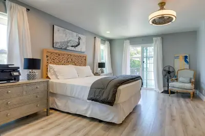 a bedroom with a bed and a dresser with a television at Family Home with Pool about 7 Mi to Downtown Sacramento! in Sacramento