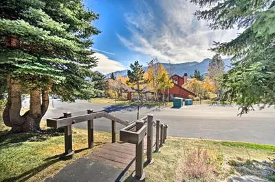 a park with a wooden boardwalk next to a parking lot at The Mammoth Lodge by Hiking, Lakes, Skiing and More! in Mammoth Lakes