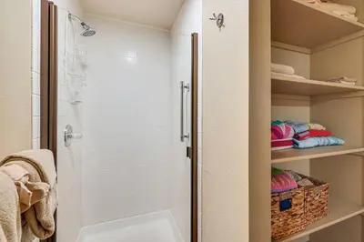 a bathroom with a shower with a glass door at 2 Mi to Diamond Peak! Corner-Unit Condo with Hot Tub in Incline Village