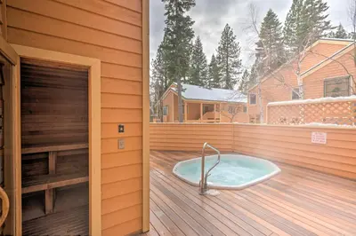 a jacuzzi tub sitting on a wooden deck at 2 Mi to Diamond Peak! Corner-Unit Condo with Hot Tub in Incline Village