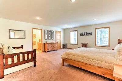 a bedroom with a bed and a dresser at Forest Views and Beach Access Family Truckee Gem in Truckee