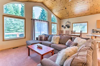 a living room with a couch and a table at Forest Views and Beach Access Family Truckee Gem in Truckee