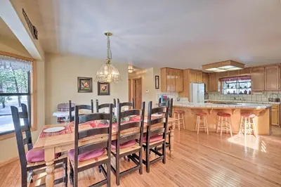 a dining room and kitchen with a table and chairs at Near Bear Valley Peaceful Arnold Home with Hot Tub in Arnold