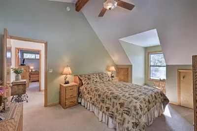 a bedroom with a bed and a ceiling fan at Near Bear Valley Peaceful Arnold Home with Hot Tub in Arnold