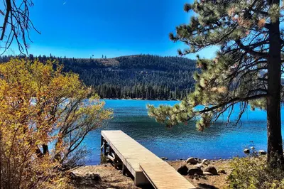 a wooden bridge over a body of water at Close to Donner Lake and Skiing Truckee Getaway in Truckee