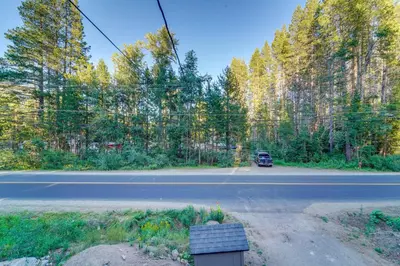 a road with a car driving down the road at 5 Mi to Skiing! Family Getaway Near Donner Lake in Truckee