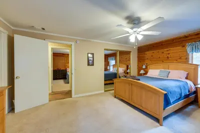 a bedroom with a bed and a ceiling fan at 11 Mi to Apple Hill Pollock Pines Resort Cabin in Pollock Pines