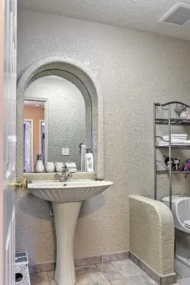 a bathroom with a sink and a mirror at Waterfront Discovery Bay Home Outdoor Bar and Dock in Discovery Bay