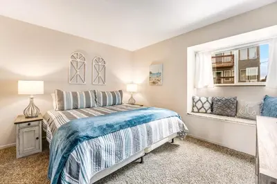 a bedroom with a bed and a window at Heavenly View 4 U in Stateline